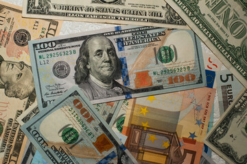 Fototapeta na wymiar dollars and euros. Background from different banknotes, different denominations. paper money, currency, cash Dollars, euros. close-up. finance, payment, trade, financial transactions concepts
