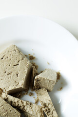 traditional eastern sweets, sunflower seed halva on white plate