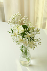 Vase with beautiful alstroemeria and gypsophila flowers