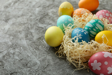 Beautiful multicolor Easter eggs on gray textured background