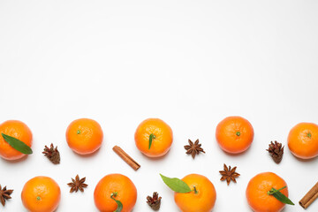 Christmas composition with tangerines on white background, flat lay. Space for text