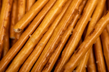 Salty bread strips spread out delicious snack surface texture.