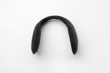 Stylish winter earmuffs on white background, top view