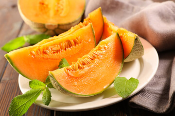 melon slice and mint leaf