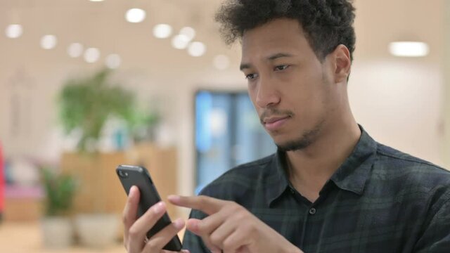 African American Man using Smartphone
