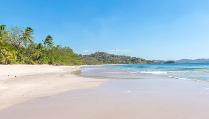 White Beach at Playa Flamingo with blue ocean. Guanacaste, Costa Rica, Central America..