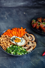 Korean national pilaf bibinpap on dark background