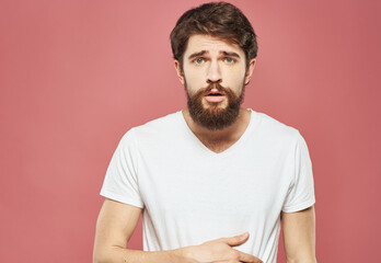 Man portrait white t-shirt pink background model bushy beard brunette