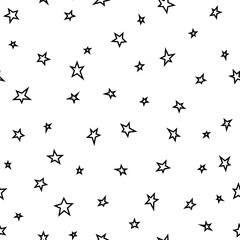 Seamless abstract pattern with black hand drawn shabby stars on white background.
