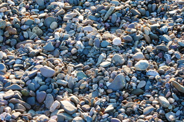 stone floor with rounded stones and footprints
