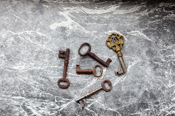 Old keys on gray surface