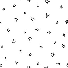Seamless abstract pattern with black hand drawn shabby stars on white background.