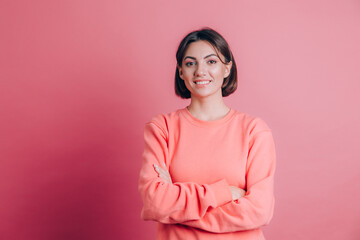 Obraz premium Woman wearing casual sweater on background happy face smiling with crossed arms looking at the camera. Positive person.