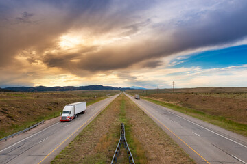 A semi truck at the I 25 interstate highway, in the State of Colorado, USA; Concept for freight...