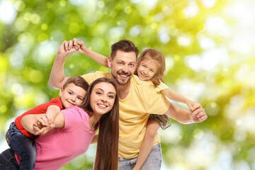 Happy family with children outdoors on sunny day