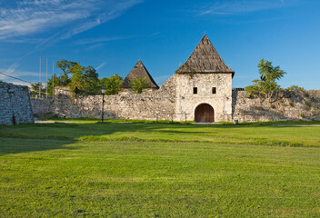 Fototapeta na wymiar Bosnia and Herzegovina - Republic Srpska - Banja Luka - Stone walls and towers of medieval fortress Kastell during warm sunny summer day