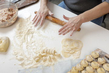homemade dumplings in the kitchen without decorations. making dumplings with minced pork, beef and chicken