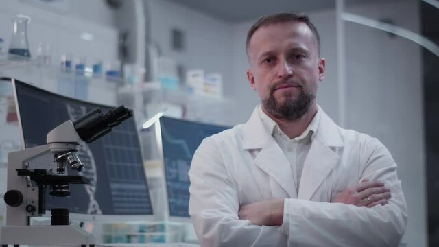 Male doctor in laboratory. Looking at camera