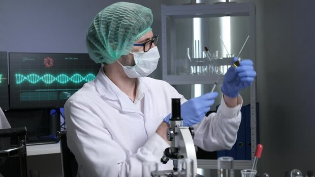 Scientists are researching for Covid19 vaccine in a laboratory. Doctors are testing  a new phamaceutical.