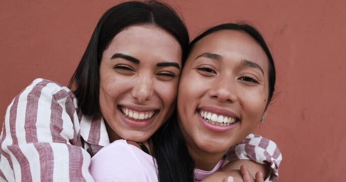 Cheerful young latin women taking selfie - Concept of friendship and happiness