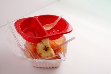 Used food box, disposable plastic containers on white background