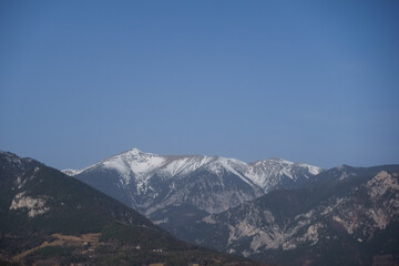 Fototapeta na wymiar mountains with snow on the top and blue sky
