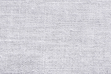 White fabric background. Grey canvas texture. Bright textile material background. Gray fiber...