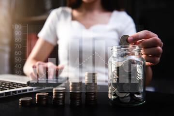 saving money with hand putting coins