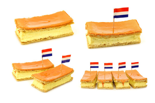 Traditional Dutch pastry called "tompouce"  and some with a Dutch flag toothpick especially produced for  Kingsday on april 27th in Holland on a white background