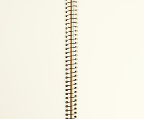 open spiral notebook with blank white sheets