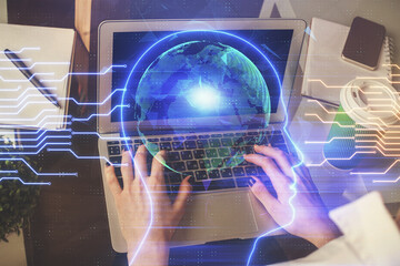 Double exposure of woman hands working on computer and brain hologram drawing. Ai concept.