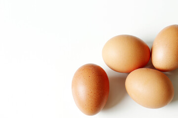 minimalism food photography, raw fresh brown egg on white background