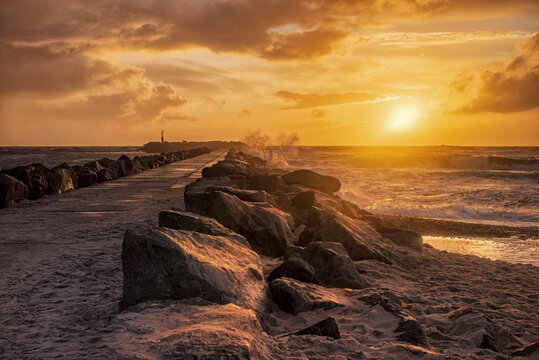Golden sky. Beautiful image of golden sunset at the west coast of Denmark. Tranquility and power. Space for text