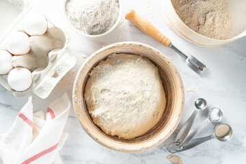 Homemade bread concept - ingredients on marble background, top view