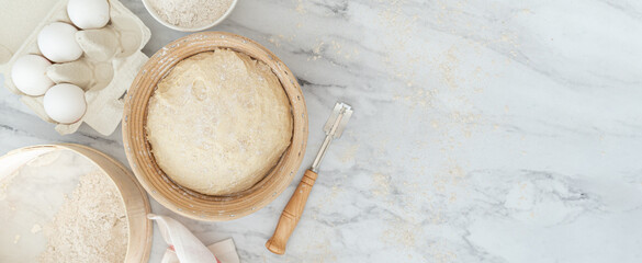 Homemade bread concept - ingredients on marble background, top view