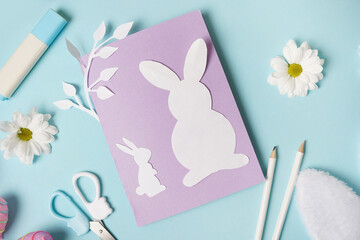 DIY ideas instruction for making Easter Card. handmade card on blue background with flowers