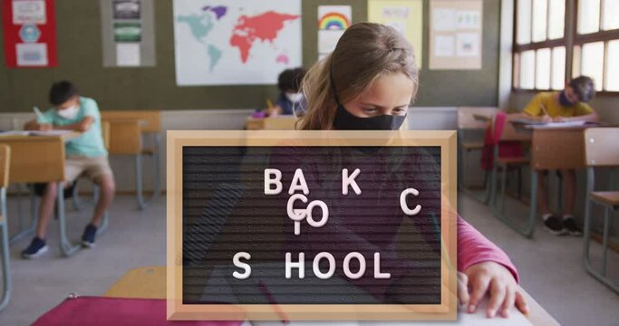 Animation of back to school text over female teacher and school children at school
