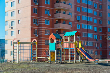 Fototapeta na wymiar Children's playground near a multi-storey residential building on Orbitalnaya in Rostov-on-Don.