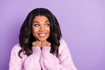 Fototapeta premium Photo of funny tricky dark skin lady dressed knitted pullover arms chin looking empty space isolated purple color background