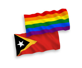 Flags of East Timor and Rainbow gay pride on a white background