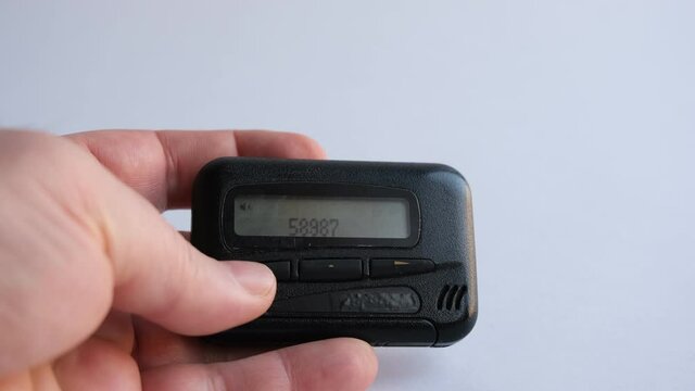 pagers, old vintage beeper, pager in hand