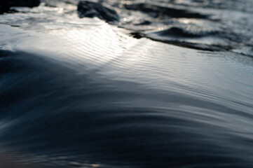 Water surface close-up. Blurred background, beautiful abstract background, fast flowing river.