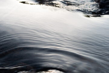 Blurred background, water surface close-up, beautiful abstract background, fast flowing river.