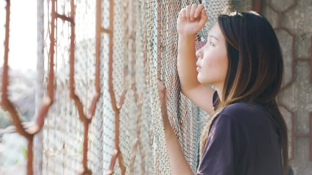 Portrait of Depressed Asian woman concept of Mental health, imprisonment Human trafficking and broken married