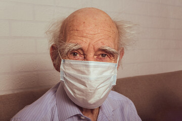 Old man in protective medical mask. Portrait.