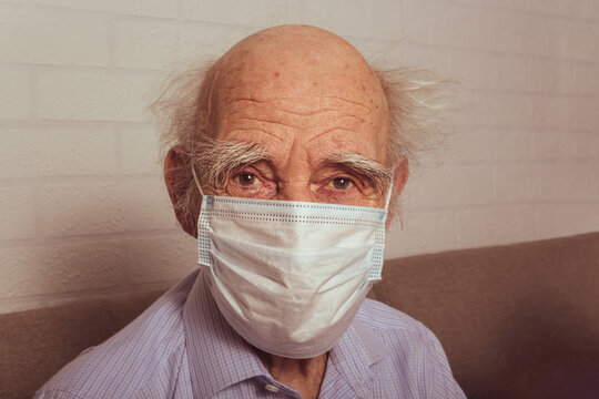 Old man in protective medical mask. Portrait.