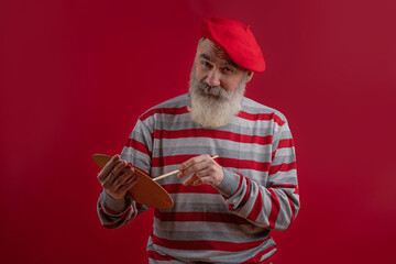 Adult handsome senior male model wearing striped sweater showing
