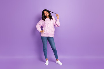 Photo of adorable pretty dark skin lady dressed knitted pullover looking empty space arm curl isolated purple color background