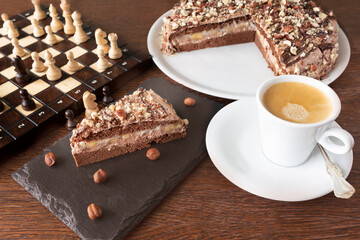 Chocolate and nuts cake with coffee and chess
