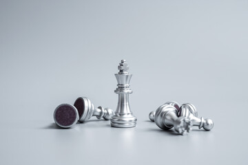 Obraz na płótnie Canvas Chess king figure stand out from crowd of enermy or opponent during chessboard competition. Strategy, Success, management, business planning, disruption, win and leadership concept